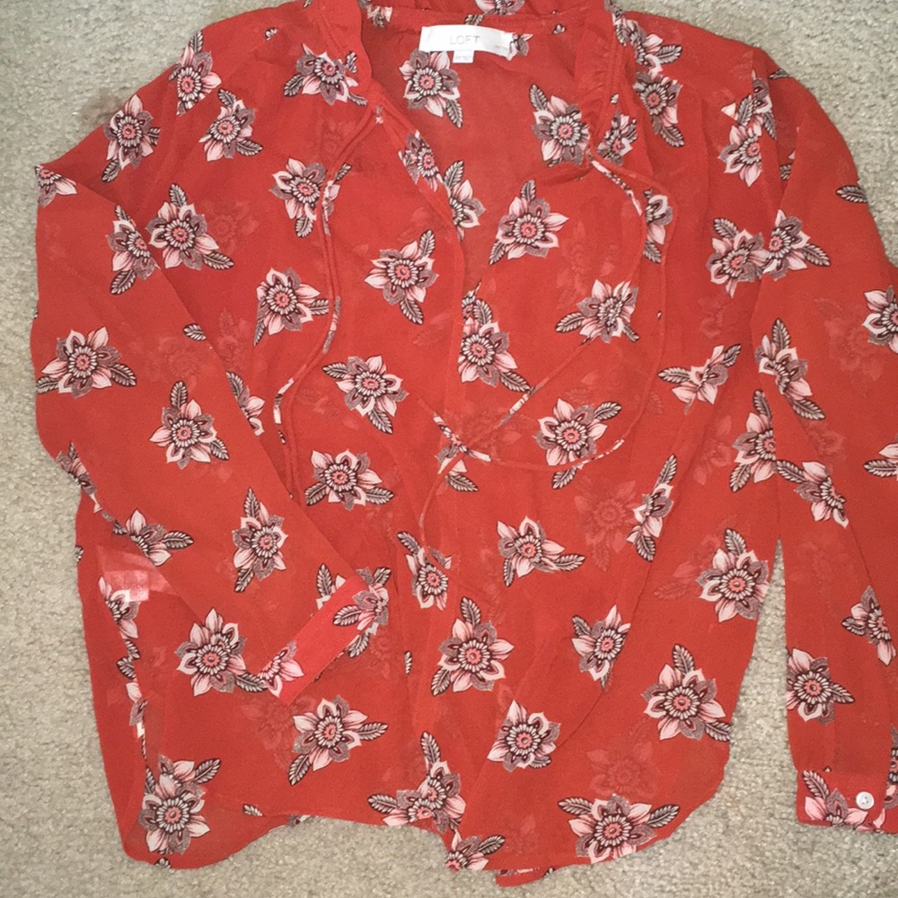 Orange paisley sheer polyester top.